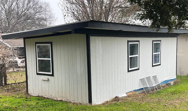 view of outbuilding featuring a yard