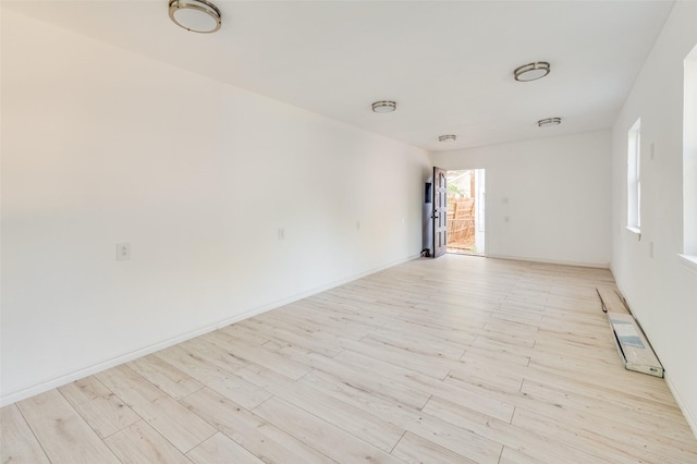 spare room featuring light hardwood / wood-style flooring