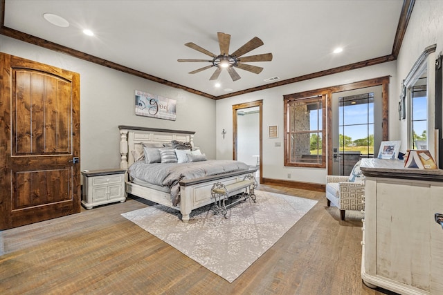 bedroom featuring light wood-type flooring, ceiling fan, and crown molding