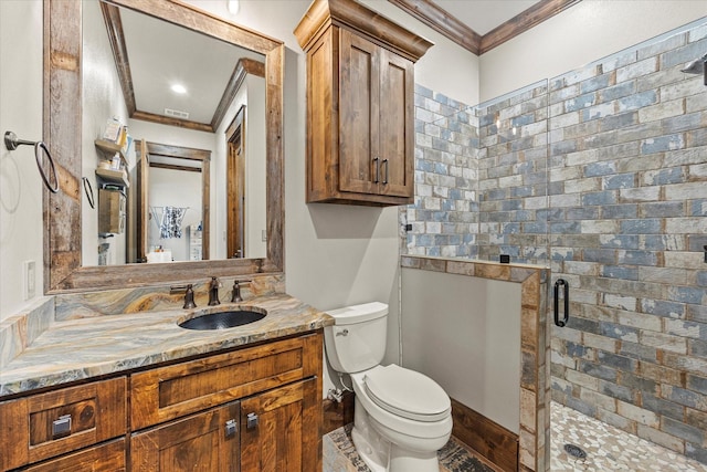 bathroom with toilet, walk in shower, ornamental molding, and vanity