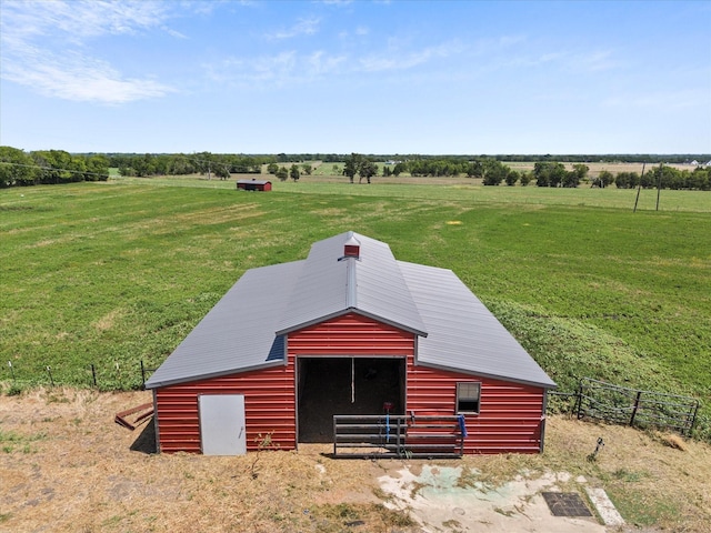 exterior space with a lawn and a rural view