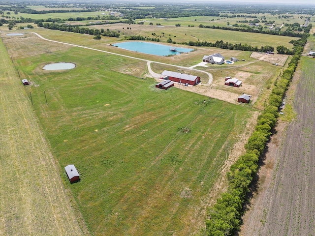 bird's eye view featuring a rural view and a water view