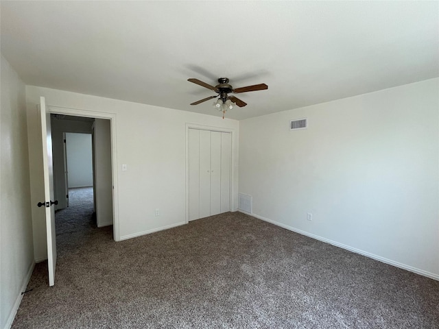 unfurnished bedroom featuring baseboards, visible vents, a closet, and carpet flooring