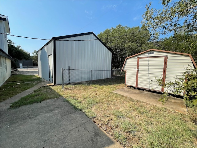 view of shed with fence