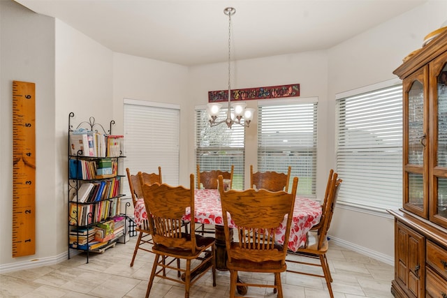 dining space featuring a chandelier