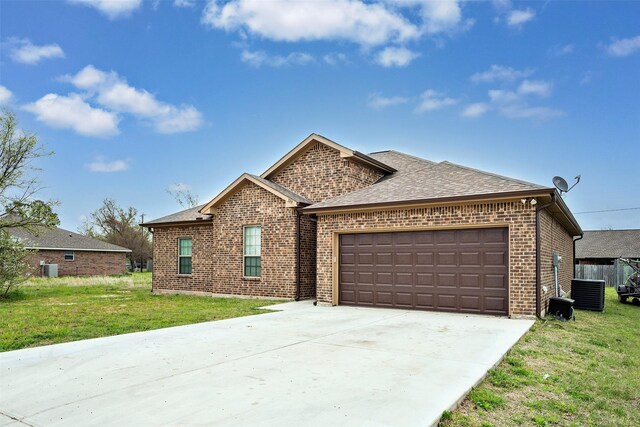 view of front of property featuring a garage and a front lawn