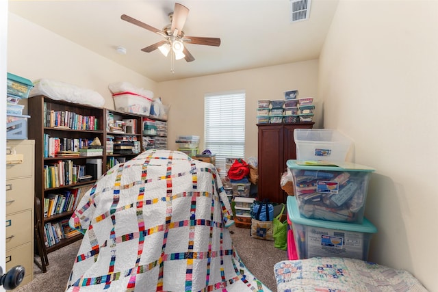 carpeted bedroom with ceiling fan