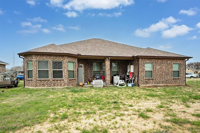 back of house featuring a yard