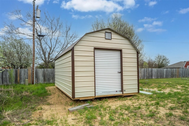 view of outbuilding featuring a lawn