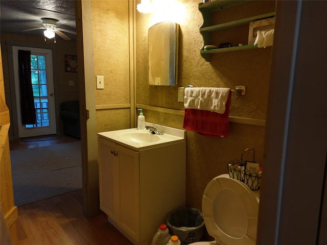 bathroom featuring vanity, hardwood / wood-style floors, and ceiling fan