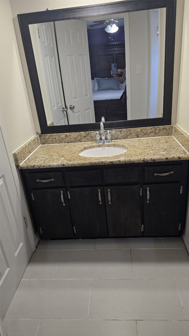 bathroom with vanity and tile patterned flooring