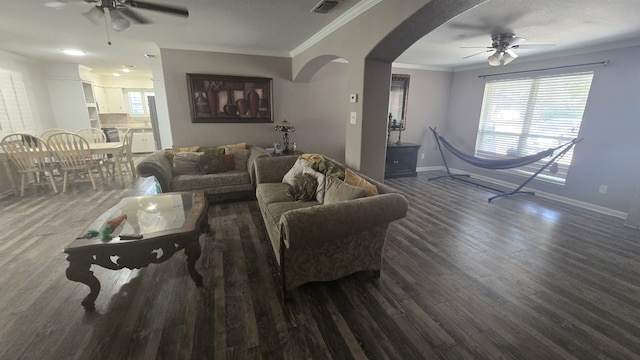 living room with ceiling fan, ornamental molding, and wood-type flooring