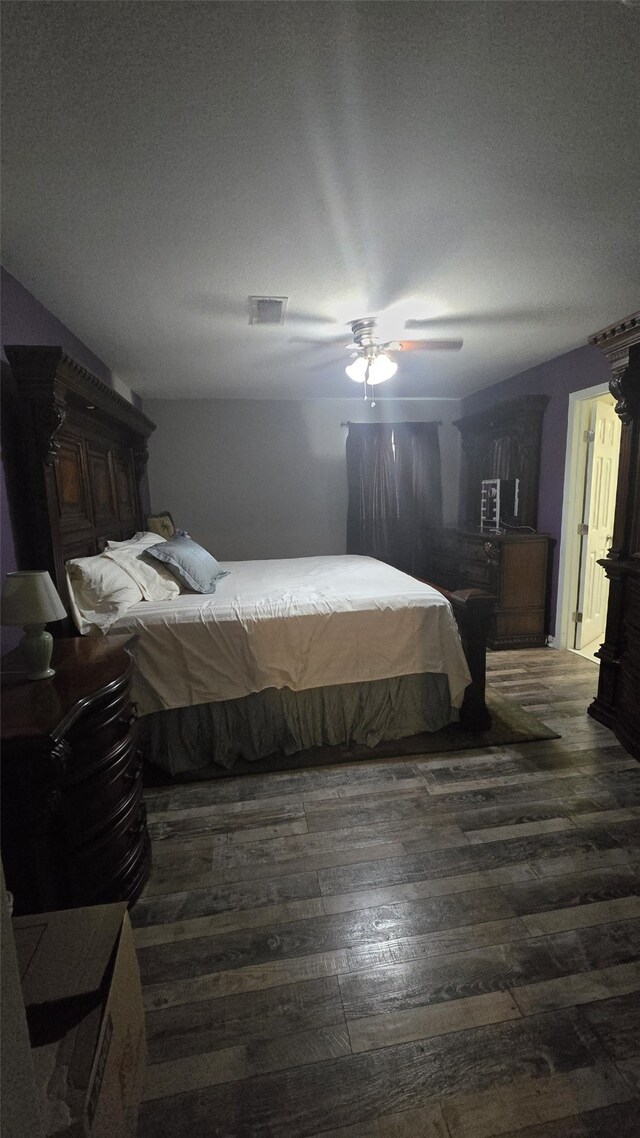 bedroom featuring ceiling fan and wood-type flooring