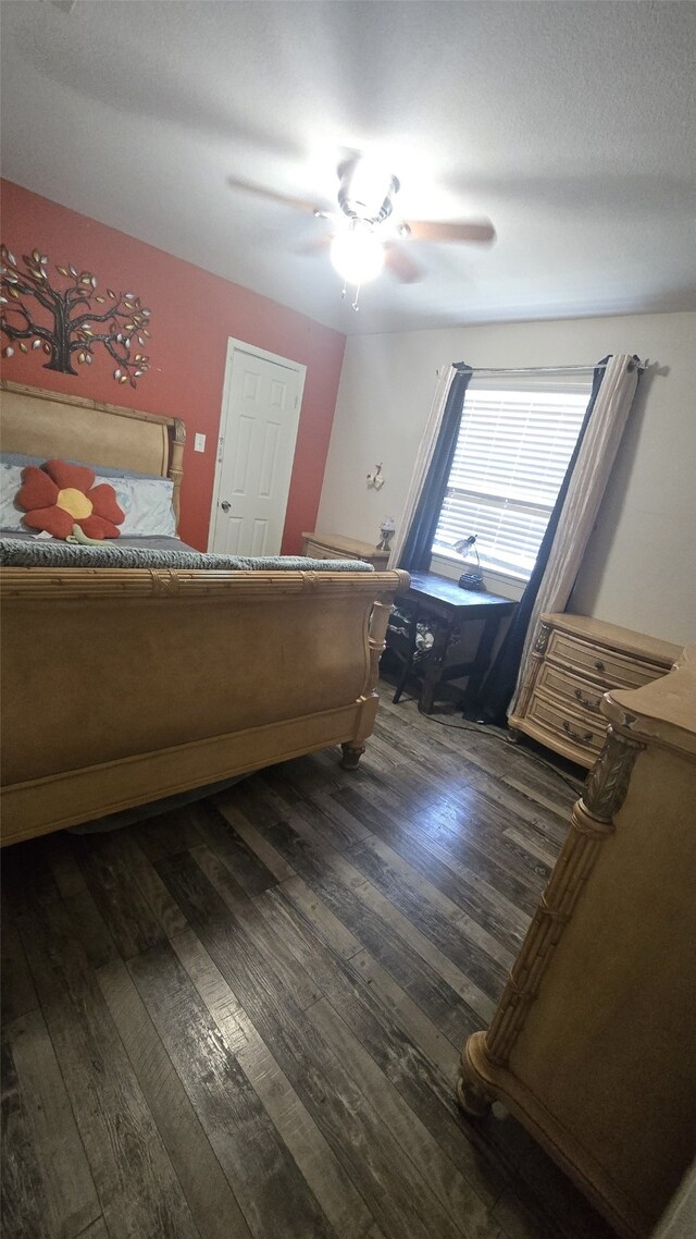 bedroom featuring dark hardwood / wood-style floors and ceiling fan