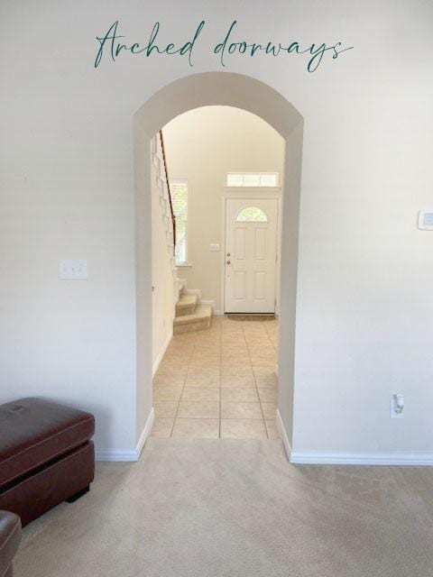 hallway featuring light carpet