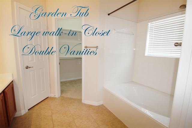 bathroom with tile patterned floors, vanity, and shower / washtub combination