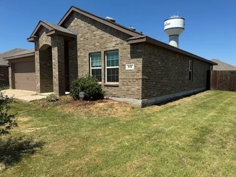 view of side of home featuring brick siding and a garage