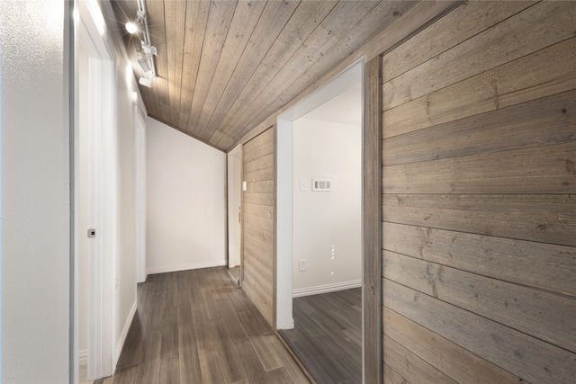 bathroom with lofted ceiling, tile patterned flooring, vanity, and toilet