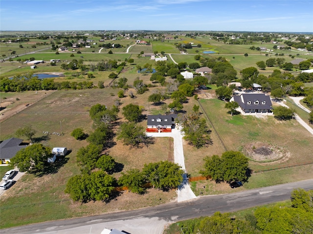 birds eye view of property with a rural view