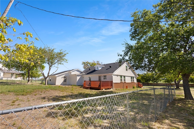 exterior space with a deck and a yard