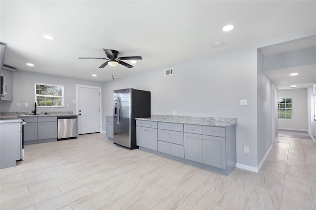 unfurnished room featuring ceiling fan and light wood-type flooring