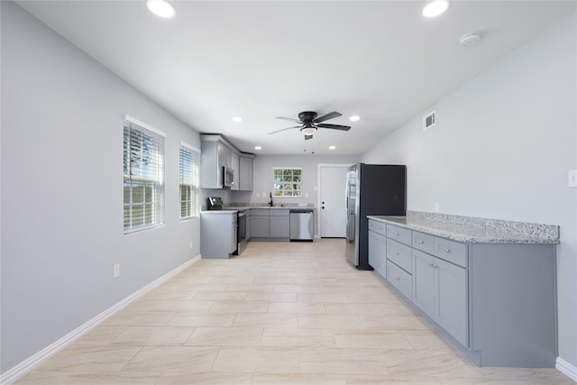 unfurnished room with ceiling fan and dark hardwood / wood-style flooring