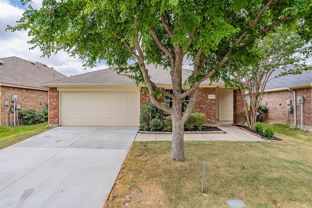 view of front of house with a garage and a front yard