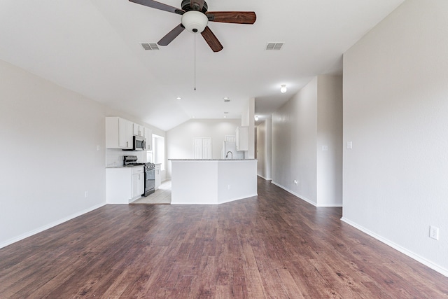 unfurnished living room featuring ceiling fan, sink, lofted ceiling, and tile patterned flooring