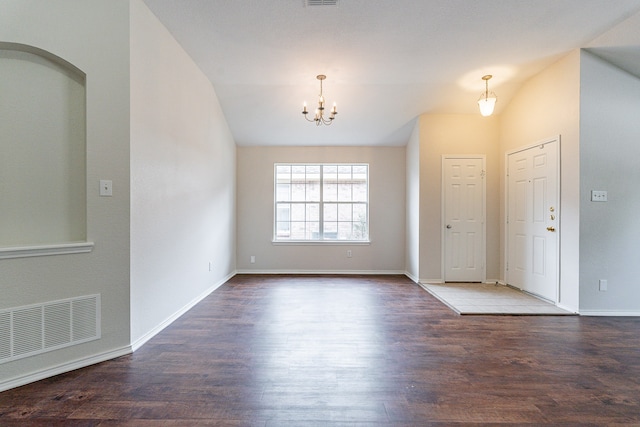 entrance foyer with an inviting chandelier and wood-type flooring