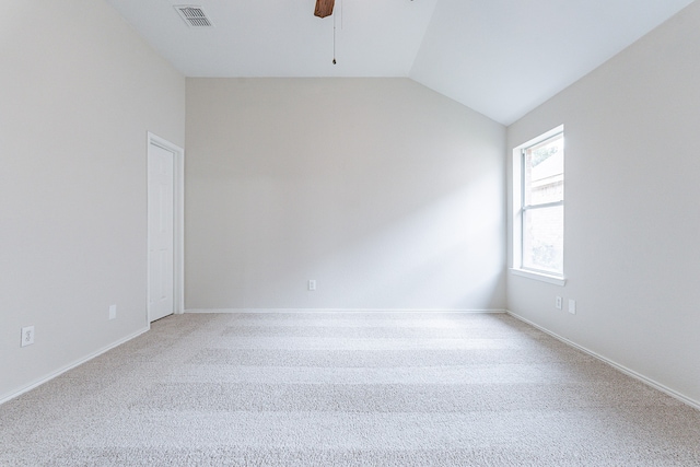 unfurnished room featuring ceiling fan, lofted ceiling, and carpet