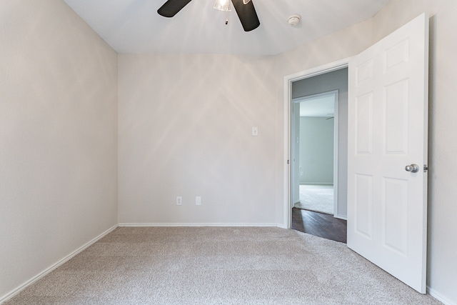 empty room with ceiling fan and carpet flooring