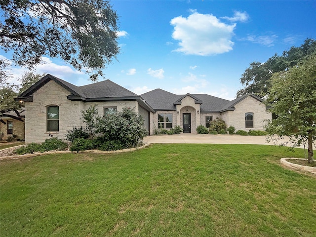 french provincial home featuring a front lawn