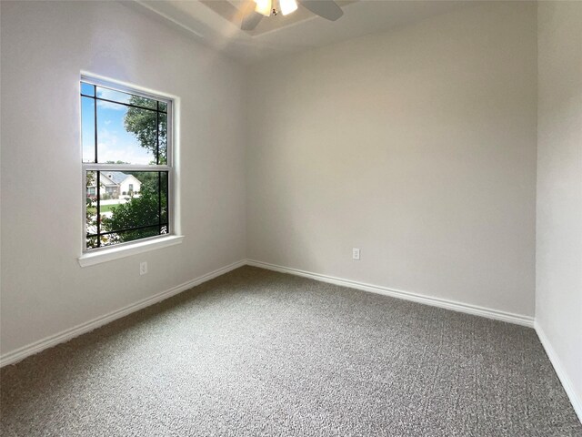 empty room featuring ceiling fan and carpet floors