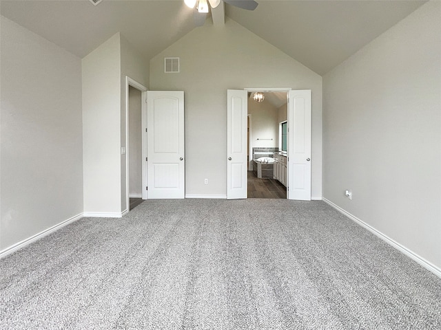 unfurnished bedroom featuring high vaulted ceiling, carpet flooring, and ceiling fan