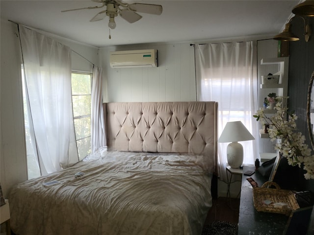 bedroom with ceiling fan and a wall mounted air conditioner