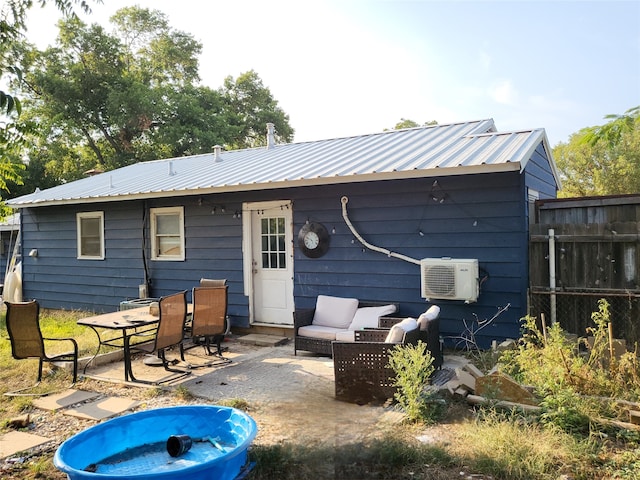 back of property with a patio area