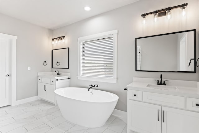 bathroom featuring vanity and a tub to relax in