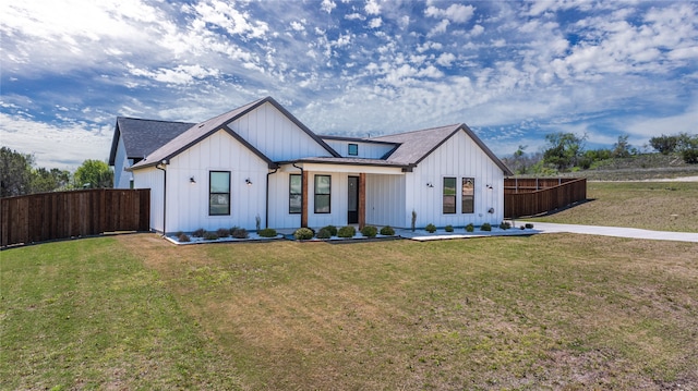 modern farmhouse with a front yard