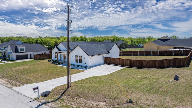 view of front facade with a front lawn and a garage