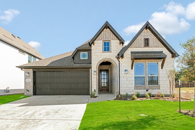 view of front facade with a garage and a front yard