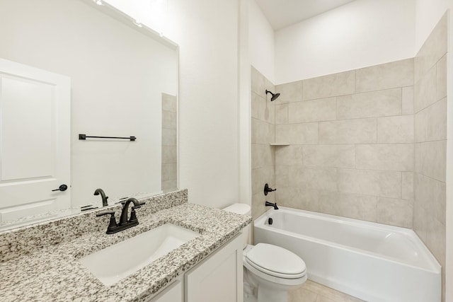 full bathroom with tile patterned floors, vanity, toilet, and tiled shower / bath