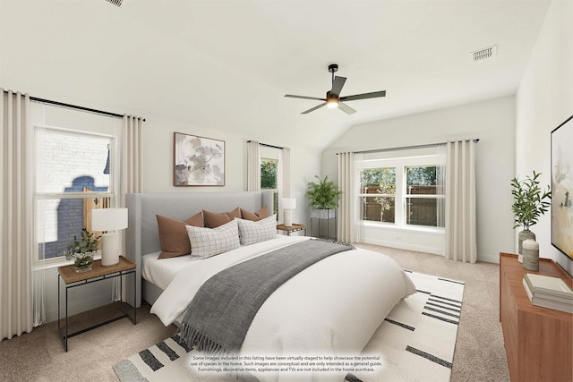 bedroom featuring ceiling fan, light colored carpet, and vaulted ceiling