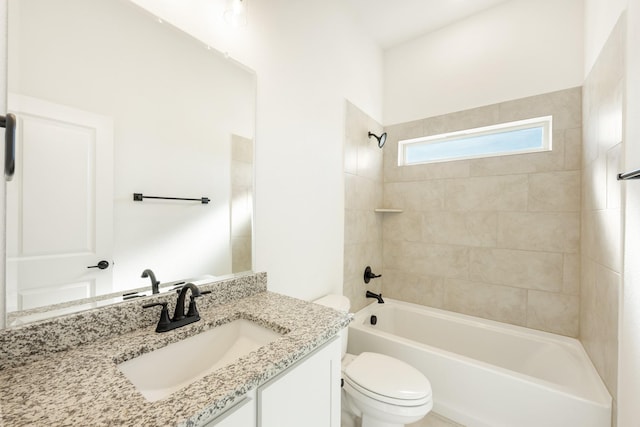 full bathroom featuring vanity, toilet, and tiled shower / bath