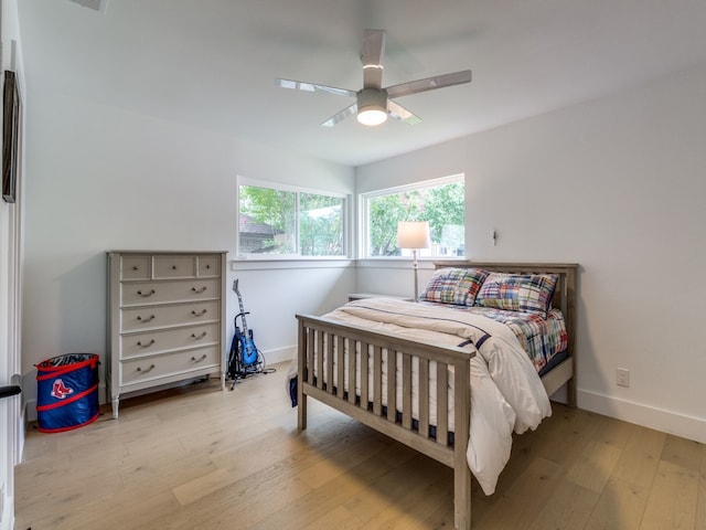 bedroom featuring ceiling fan and light hardwood / wood-style flooring