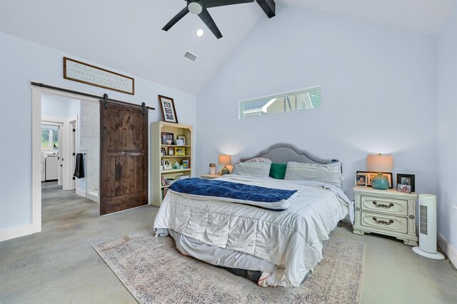 bedroom with beam ceiling, ceiling fan, high vaulted ceiling, and a barn door