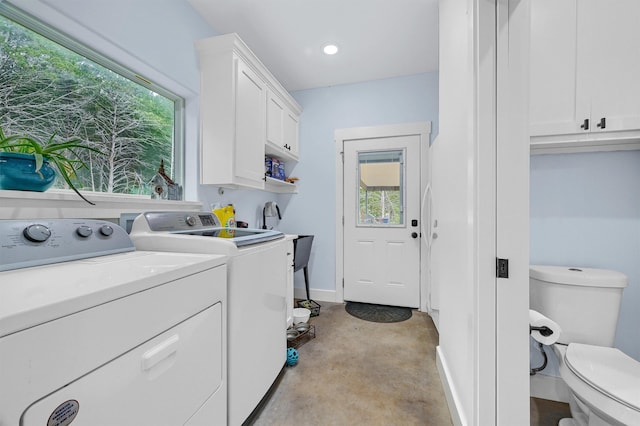 washroom with sink and washer and clothes dryer