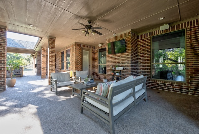 view of patio / terrace featuring ceiling fan and an outdoor living space