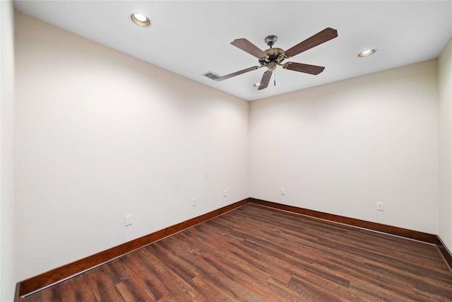 empty room featuring hardwood / wood-style floors and ceiling fan