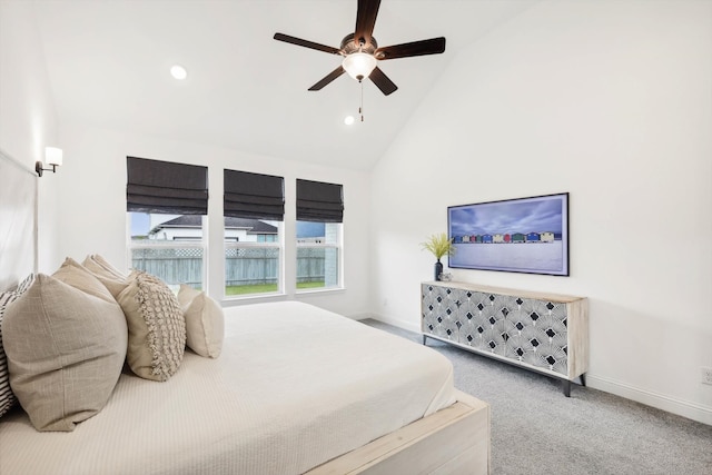 carpeted bedroom with high vaulted ceiling and ceiling fan