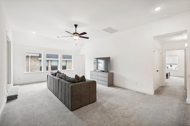 carpeted living room with ceiling fan